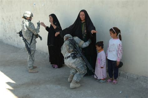 Two Female Us Army Soldiers Search Two Iraqi Women
