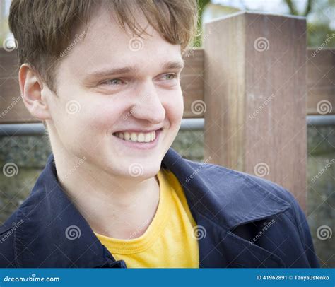 Handsome Young Man Sitting On A Bench Smiling Stock Image Image Of