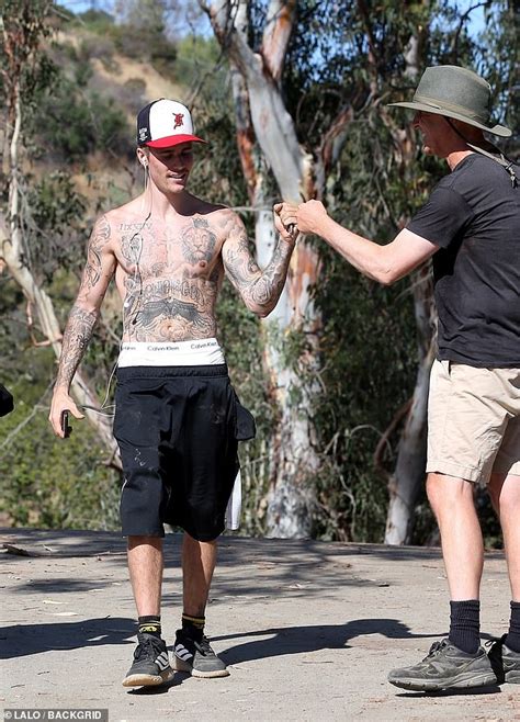 Justin Bieber Is All Smiles As He Enjoys A Shirtless Hike Through