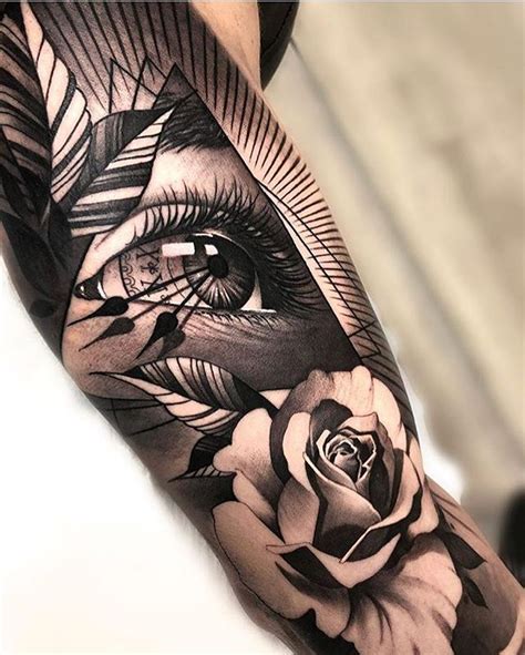 Amazing Black And Grey Realism Eye And Rose Tattoo By