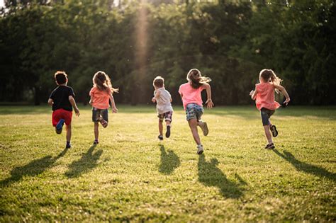 Back View Group Of Children Running In Nature Stock Photo Download