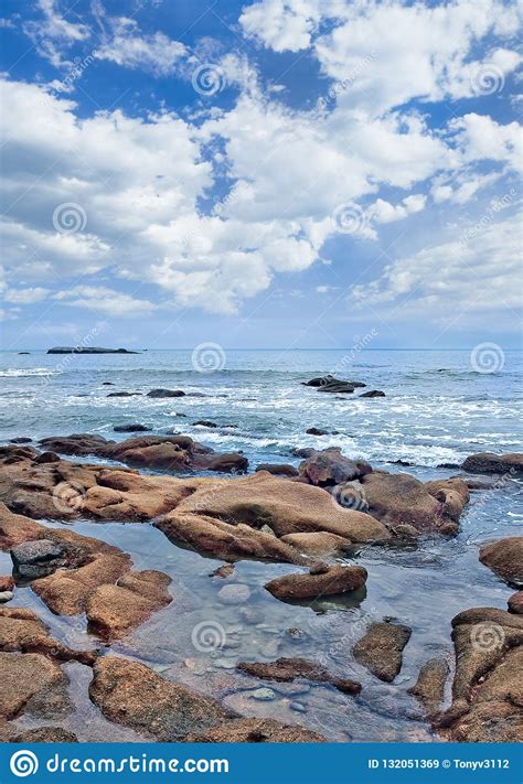 Tranquil Seashore With Erratic Shaped Rocks Stock Image Image Of