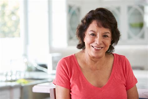 Head And Shoulders Portrait Of Senior Hispanic Woman At Home Atlas