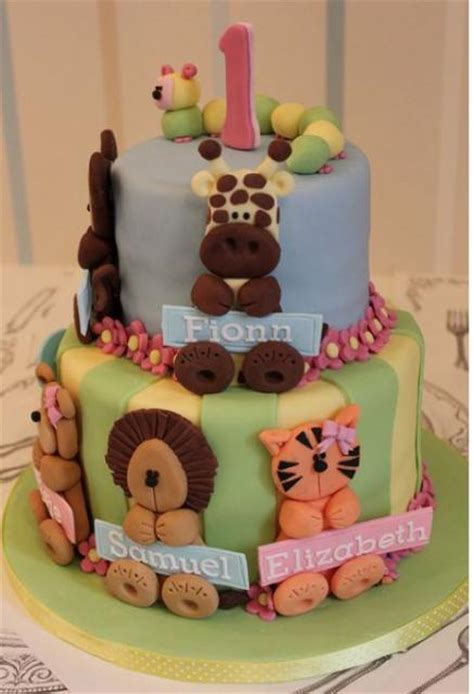 First birthday cakes for boys. Two tier first birthday cake with animal theme for baby ...