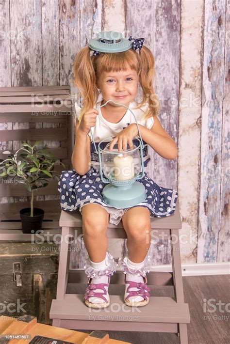 Portrait Of Little Girl In Retro Vintage Photographic Studios Stock