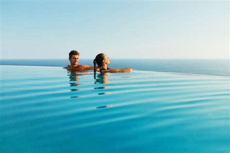 Couple In Love In Luxury Resort Pool On Romantic Summer Vacation Stock