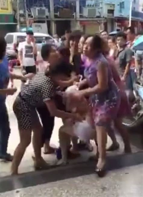 Mob Of Angry Wives Strip Mistress In Street After She Play Woman