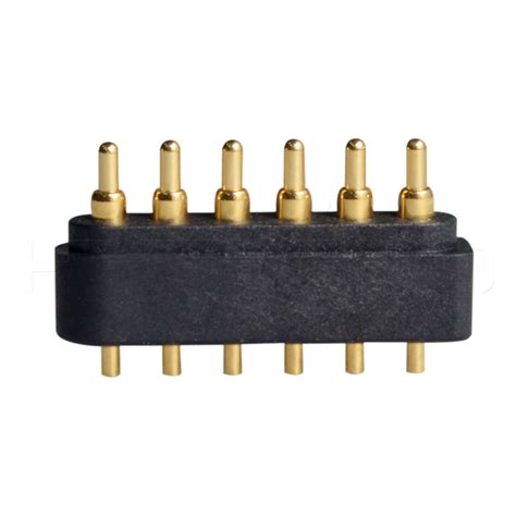 An Image Of A Black And Gold Connector With Six Brass Plugs On The End