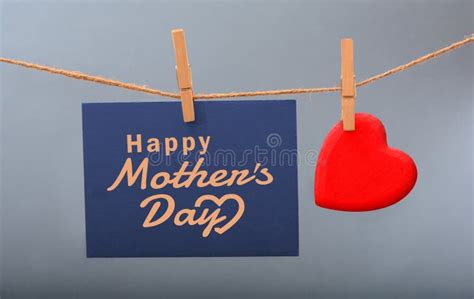 Happy Mothers Day Paper With Red Heart Icon Hanging With Rope Stock