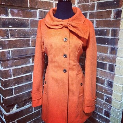 tomato red coat w adorable bow detail from twisted heart boutique the shoppes at brownstone