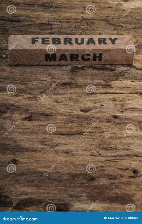 Cube Calendar For February And March On Wooden Background Stock Image