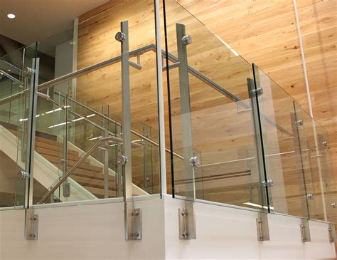 Between the columns of the steel railings can be placed glass panes in different shapes, thickness and colors. Summit Commercial Glass Railings | SC Railing Company