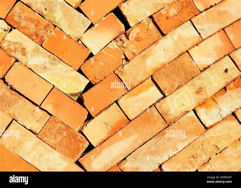 The Orange Brick Is Stacked In Even Oblique Rows Texture Of A Brick