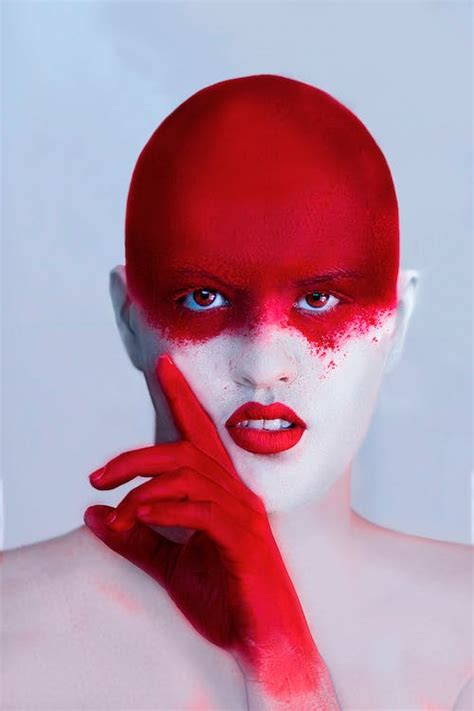 Woman With Red Face Paint · Free Stock Photo