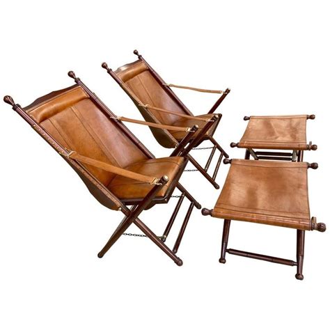 Shoemaker sling folding chairs in cueramo wood and black leather. Pair of Brown Leather Campaign Folding Chairs by Palecek ...
