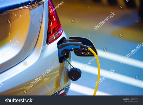 Electric Vehicle Charging Port Plugging Ev Stock Photo 1458929579