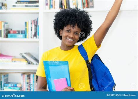 Successful Cheering African American Female Student With Yellow Shirt