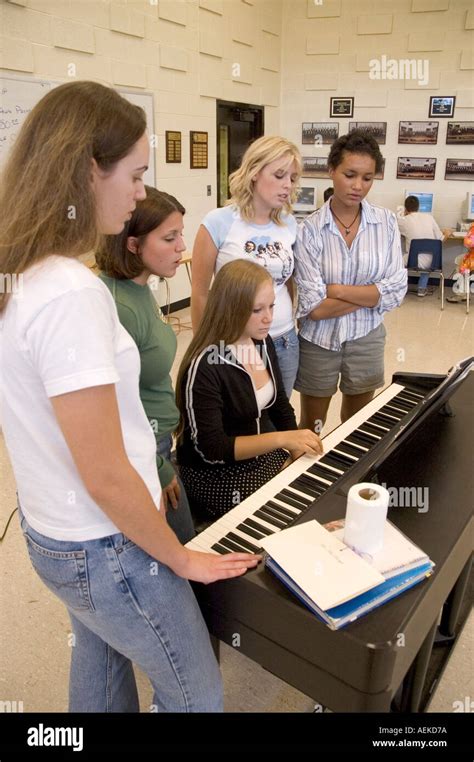 High School Students Practice Musical Routine Using Piano In Choir
