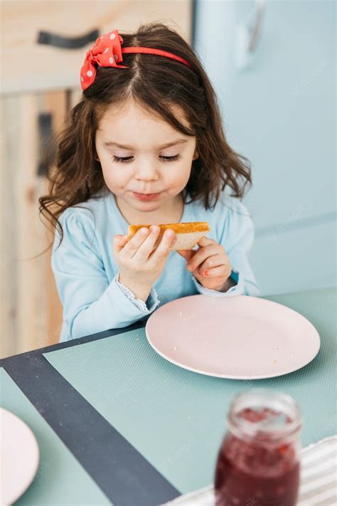Free Photo Little Girl Having Her Breakfast