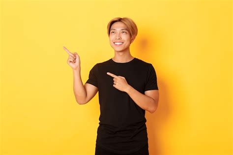 Free Photo Portrait Of Handsome Korean Blond Guy Pointing Fingers