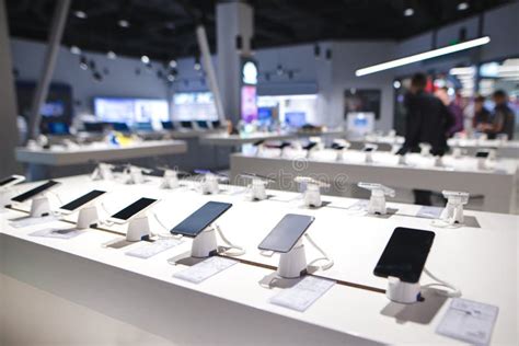 Showcase With Smartphones In The Modern Electronics Store Many