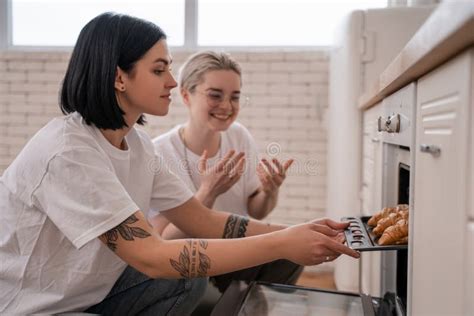 Tattooed Lesbian Couple Taking Oven Tray Stock Image Image Of Kitchen Lgbt 219644039