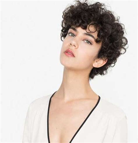 This soft sleek pixie haircut has a classic retro style to it, with the exception of a soft auburn highlight added to the front bang area to add a little depth to the brunette hair color. Effective Styles for Short Curly Hair