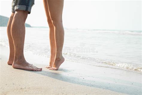 Legs Of Kissing Couple On Beach Romantic Couple On The Beach Stock