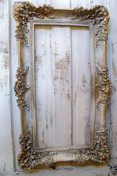 An Ornate Gold Frame Hanging On The Side Of A Wooden Wall With Peeling