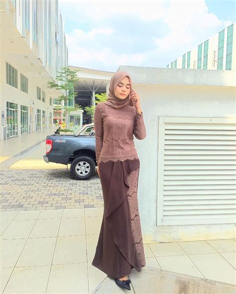 image may contain 1 person standing and outdoor kebaya dress hijab fashion model kebaya modern