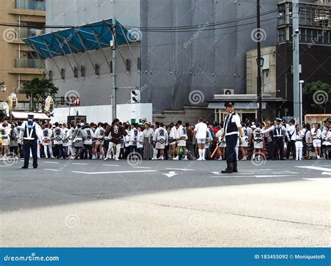 japanese uniformed police officers organizing the traffic in tokyo japan asia editorial image