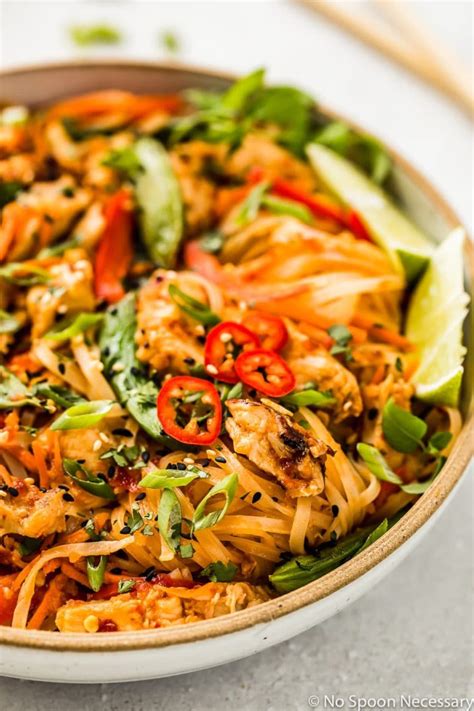 How to make spicy thai chicken with veggie noodles. Angled, up close shot of Thai Spicy Chili Chicken ...