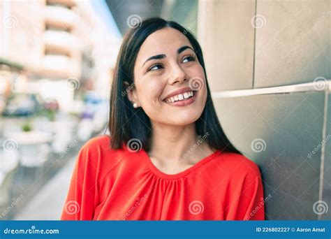 Young Latin Girl Smiling Happy Leaning On The Wall At The City Stock Image Image Of Hispanic
