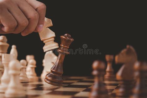 Male Hand Moving Chess Piece On Chess Board Game Concept For Ideas And