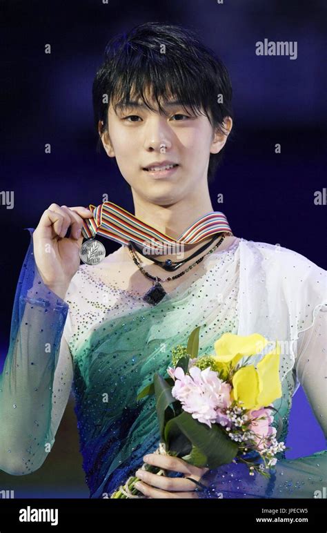 Olympic Champion Yuzuru Hanyu Of Japan Holds Up His Silver Medal At The