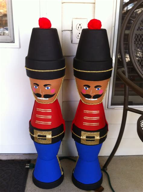 Two Nutcrackers Are Standing Next To Each Other In Front Of A Door