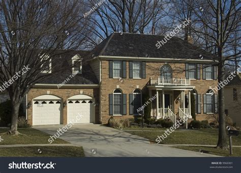 Charming Suburban Colonial Style Brick House Stock Photo 9966901