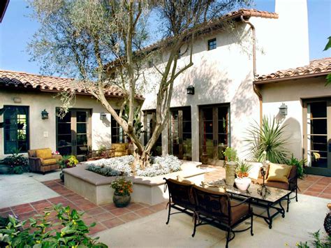 Wrought iron may be found by. Spanish courtyard with raised center planter … | Spanish ...
