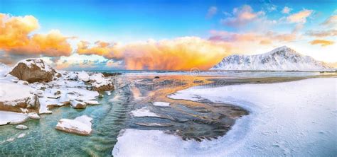 Incredible Winter Scenery On Skagsanden Beach With Illuminated Clouds