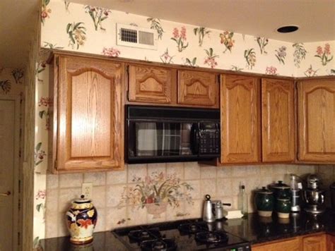 The best place for soffits is above cabinets, directly under the ceiling. unsightly kitchen soffits over cabinets