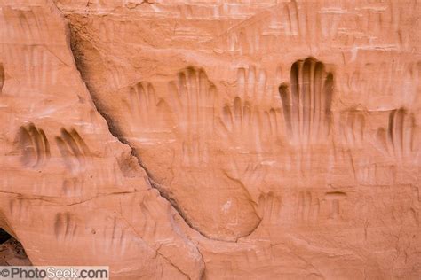 Human Hands Have Scratched Handprints Into Sandstone At A Cave In