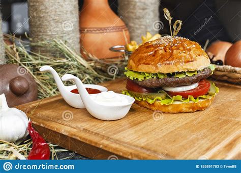 Hamburger With French Fries Ketchup And Creamy Sauce In Oriental Style