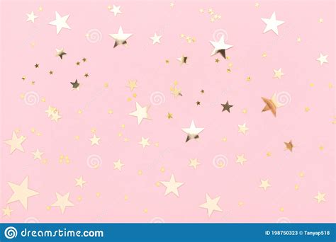 Pink Pastel Festive Background With Shining Golden Confetti In Shape Of