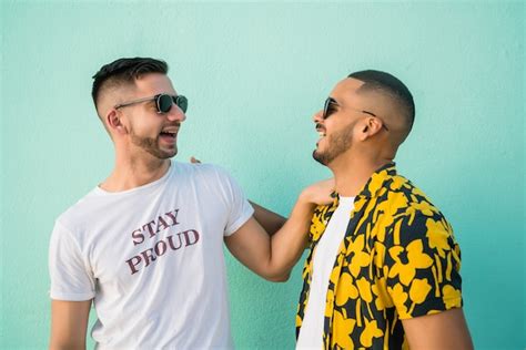 Free Photo Portrait Of Happy Gay Couple Spending Time Together While Sitting On Stairs