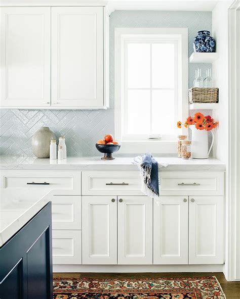 From light baby blue with gray undertones to dark navy, i am just completely smitten. Light Blue Herringbone Tiles with White Cabinets ...