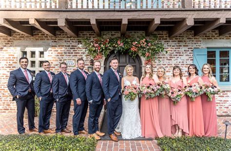 Wedding Party With Groomsmen In Navy Suits And Pink Ties Bridesmaids
