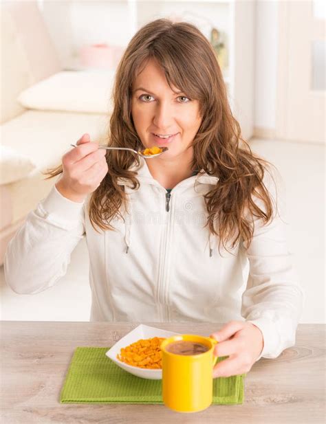 Woman Eating Breakfast At Home Stock Photo Image Of Cornflakes