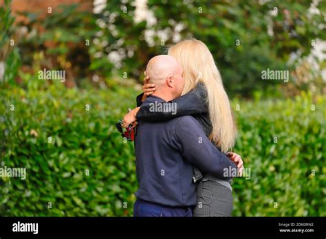 A Couple Of Lovers Showing Affection In A Public Place By Hugging Each