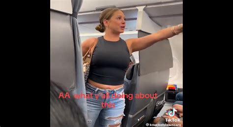 woman freaks out on airplane and says she s getting off the plane because the person she was