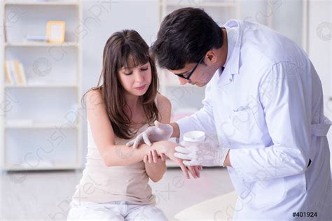 Doctor Examining The Skin Of Female Patient Stock Photo Crushpixel
